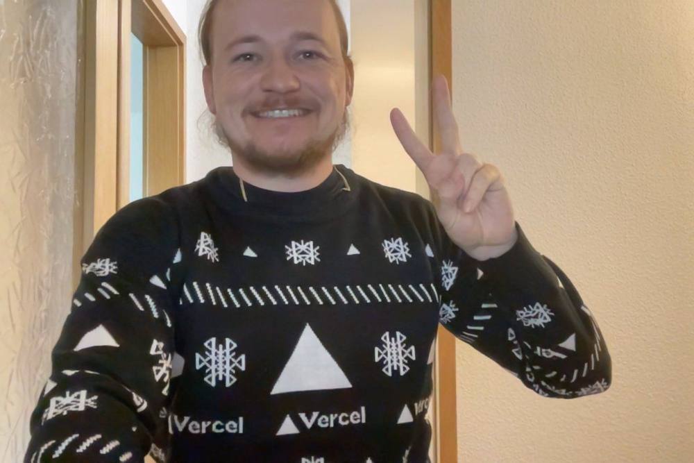 Vercel Christmas sweater with ▲ triangles