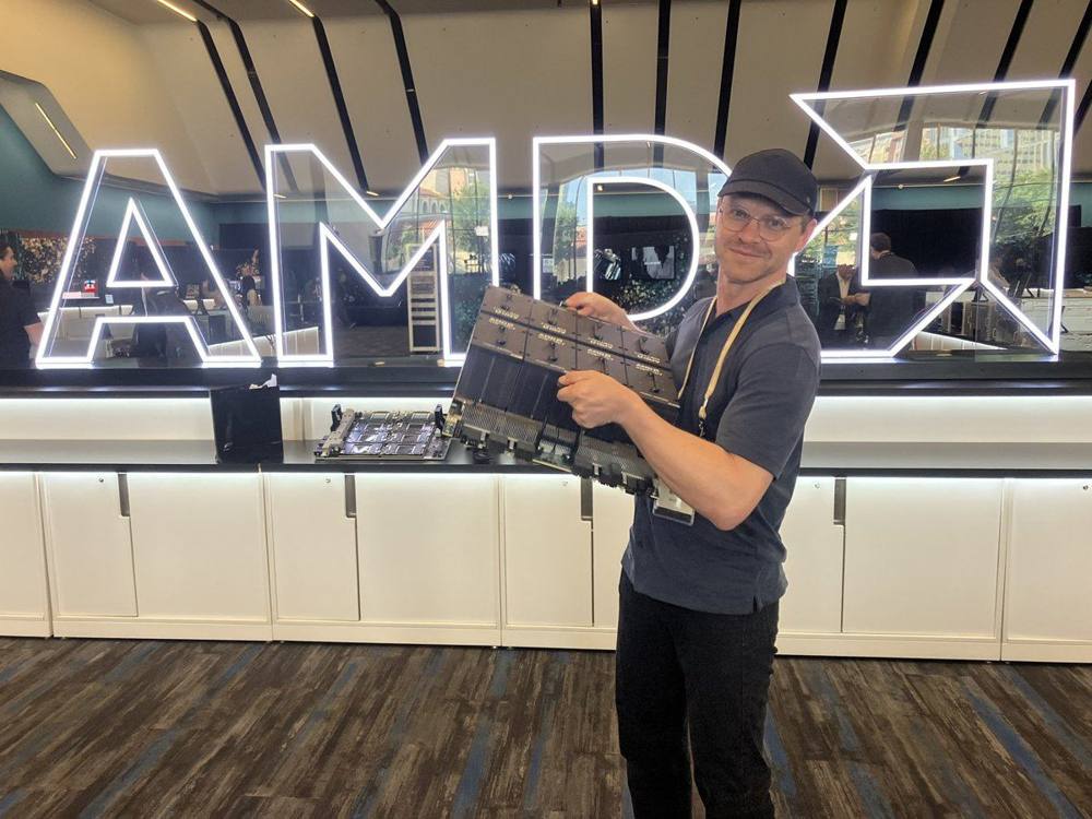 AMD Advancing AI swag bag (next to a MI350X server)